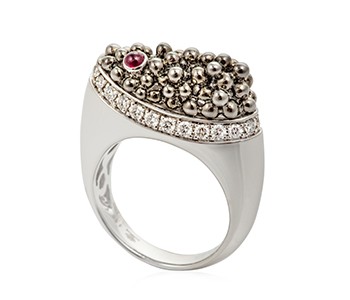 Caviar, diamonds, ruby, white gold everywhere, apart from the black beads on the top section of the ring, which are black gold1